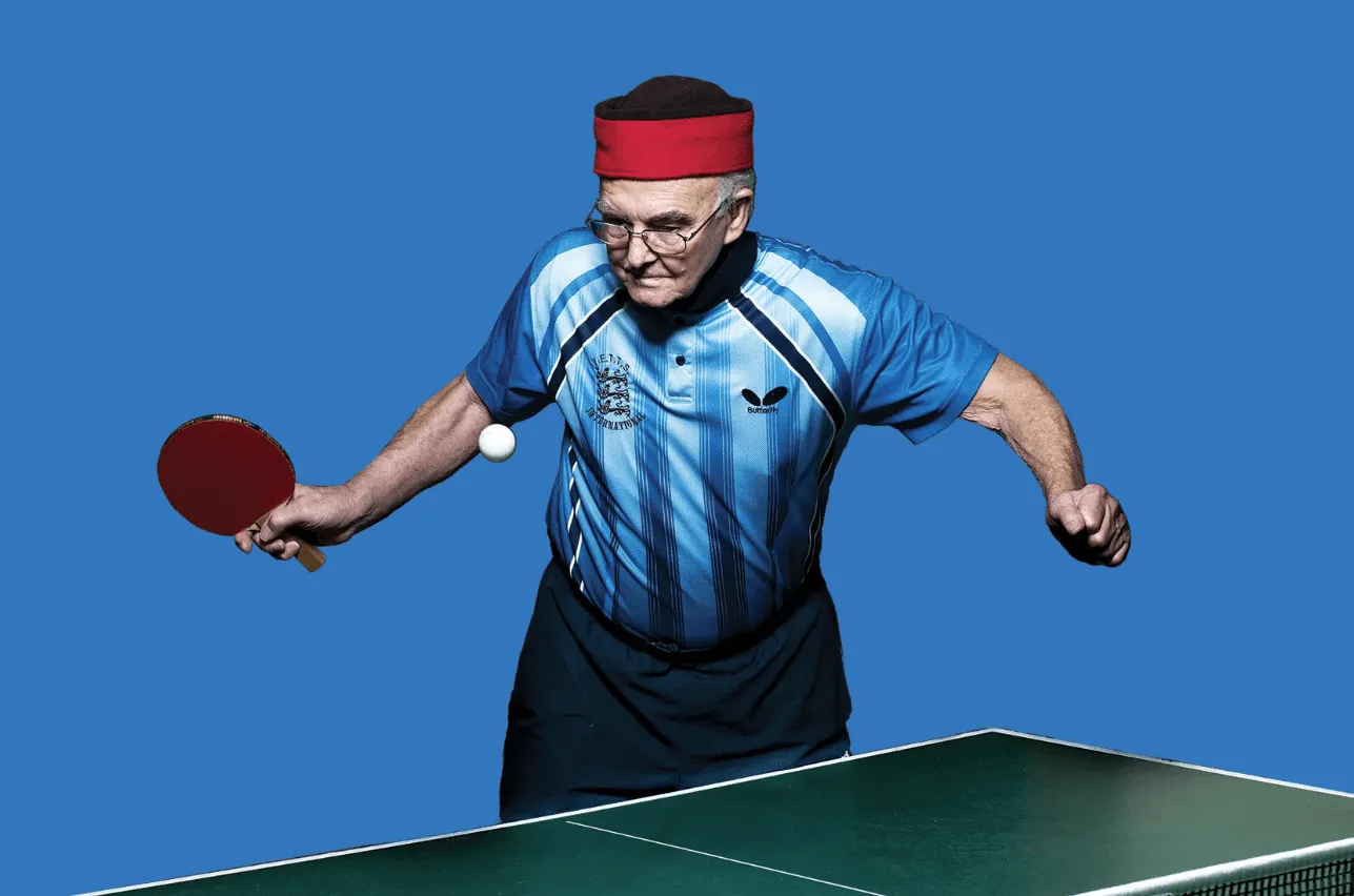 Image of older man playing ping pong