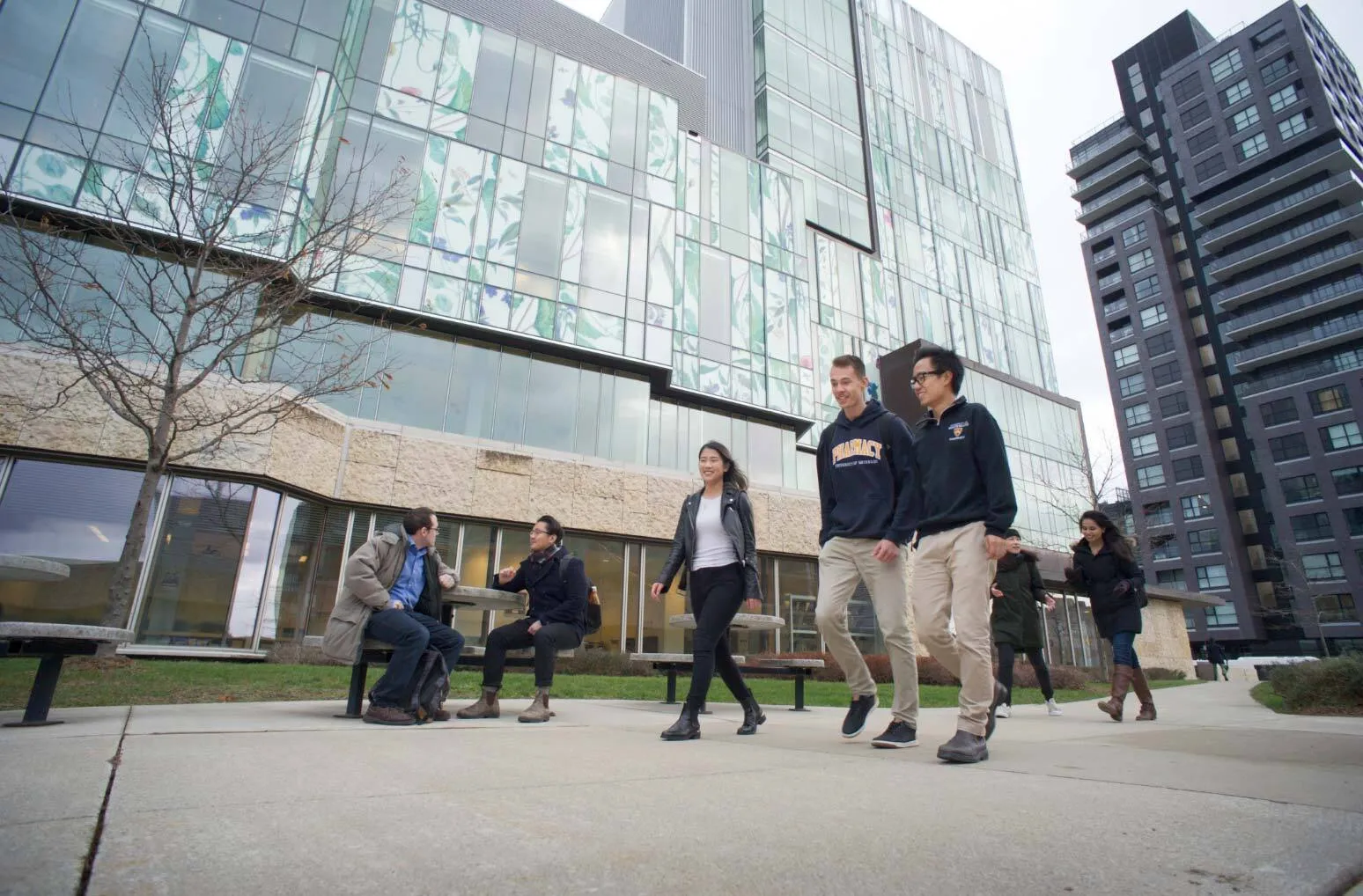 student walking through UW school of pharmacy campus